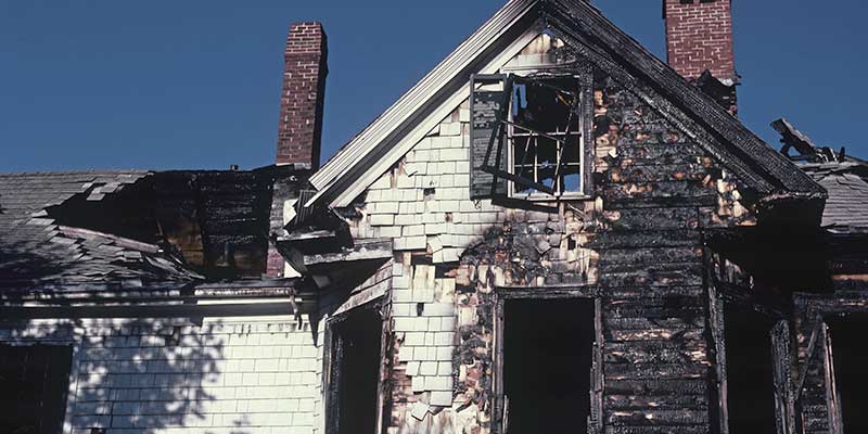 fire-damaged house exterior