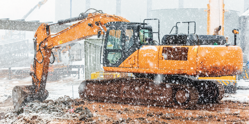 excavator working in the snow